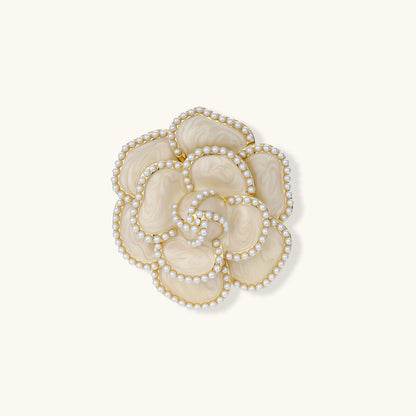 Elegant cream-colored rose brooch with gold plating, zirconia stones, and pearl-like border details on neutral background.